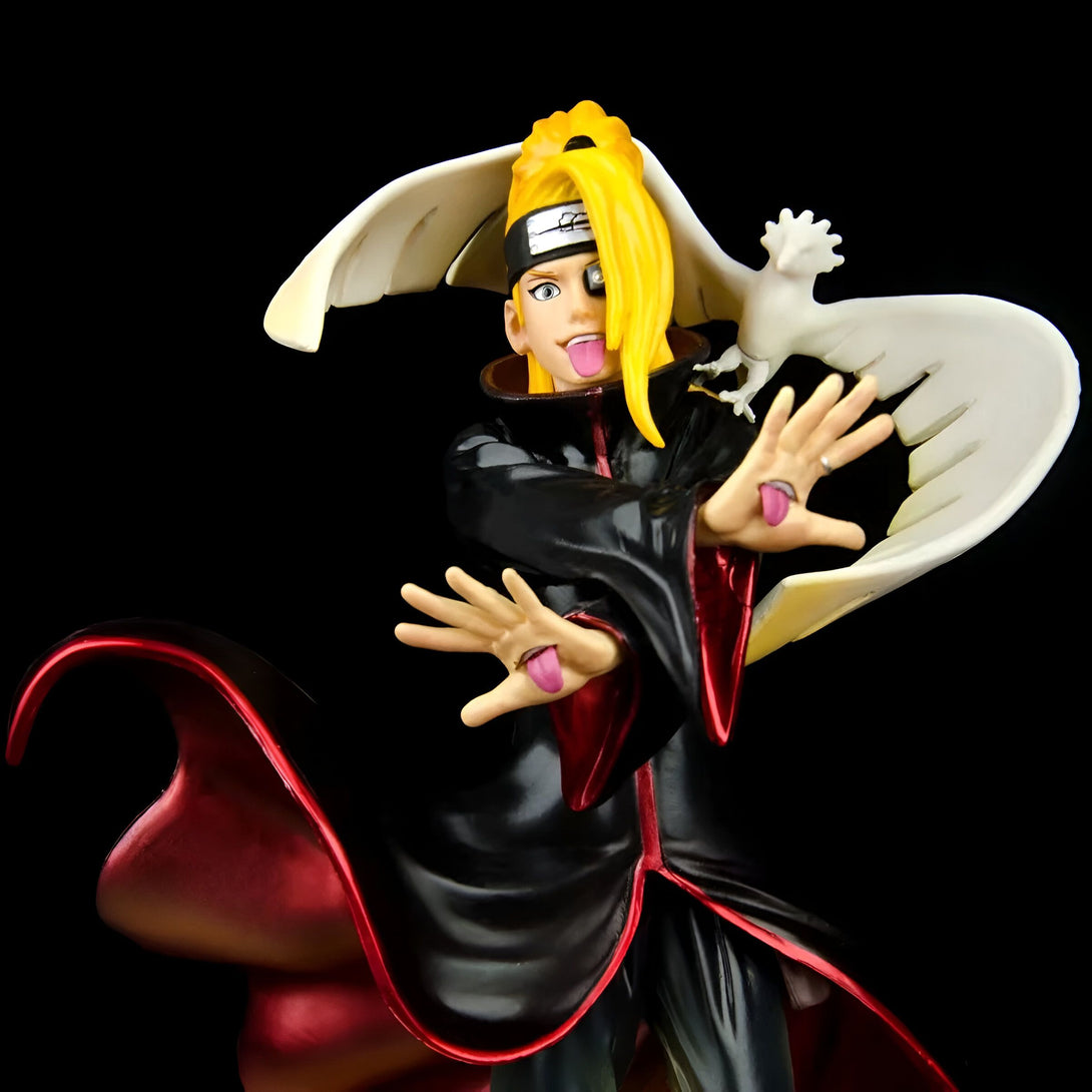 Figure de Pain, un personnage de l'anime Naruto, avec sa cape rouge et ses cheveux blonds, tenant un oiseau blanc. Il porte un bandeau frontal et un symbole rouge sur son visage.