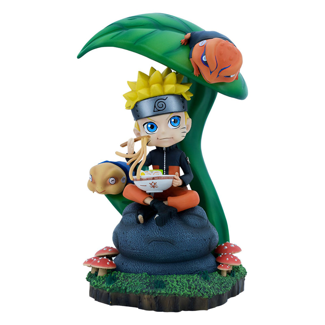 Naruto Uzumaki, le célèbre ninja de Konoha, mange un bol de ramen assis sur un rocher avec ses deux crapauds familiers, Gamakichi et Gamabunta, sous une feuille de plante verte.