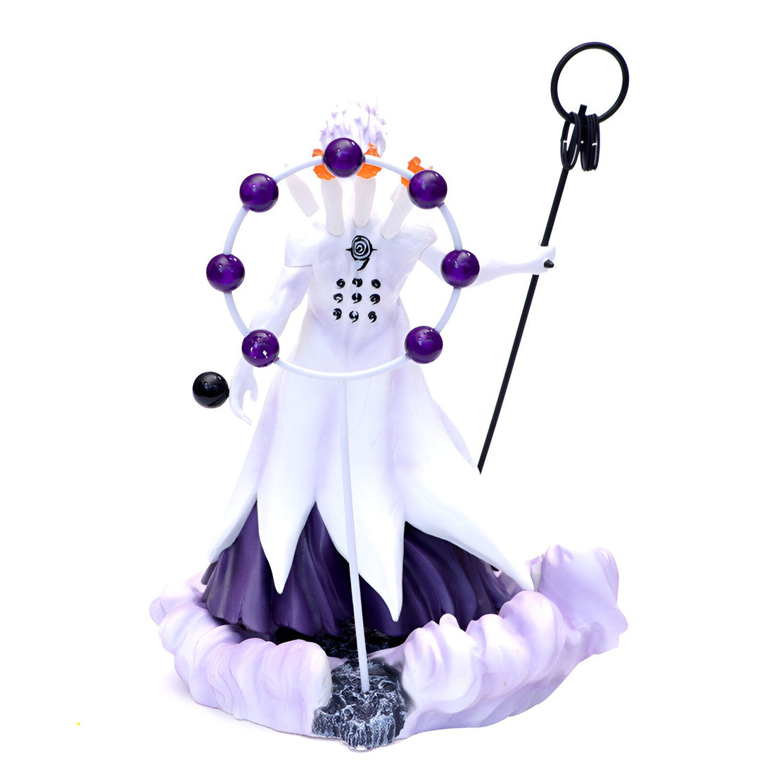 Figure de collection de Kaguya Otsutsuki de Naruto, avec sa tenue blanche et sa robe violette, tenant un bâton et entourée d'un cercle de sphères violettes.
