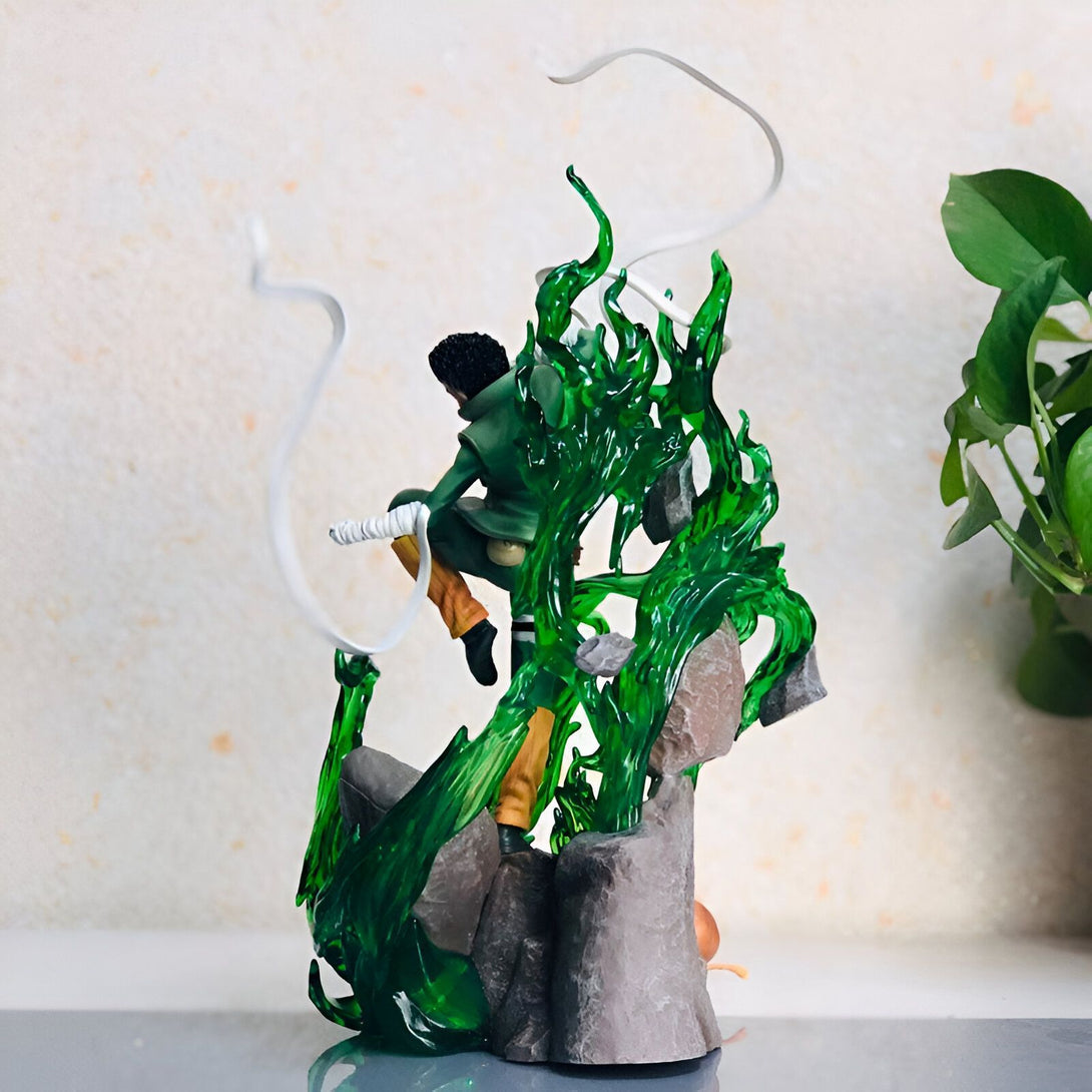 Figure de Rock Lee en PVC de Naruto Shippuden, avec un effet de feu vert et une pose dynamique, sur une base de rocher.