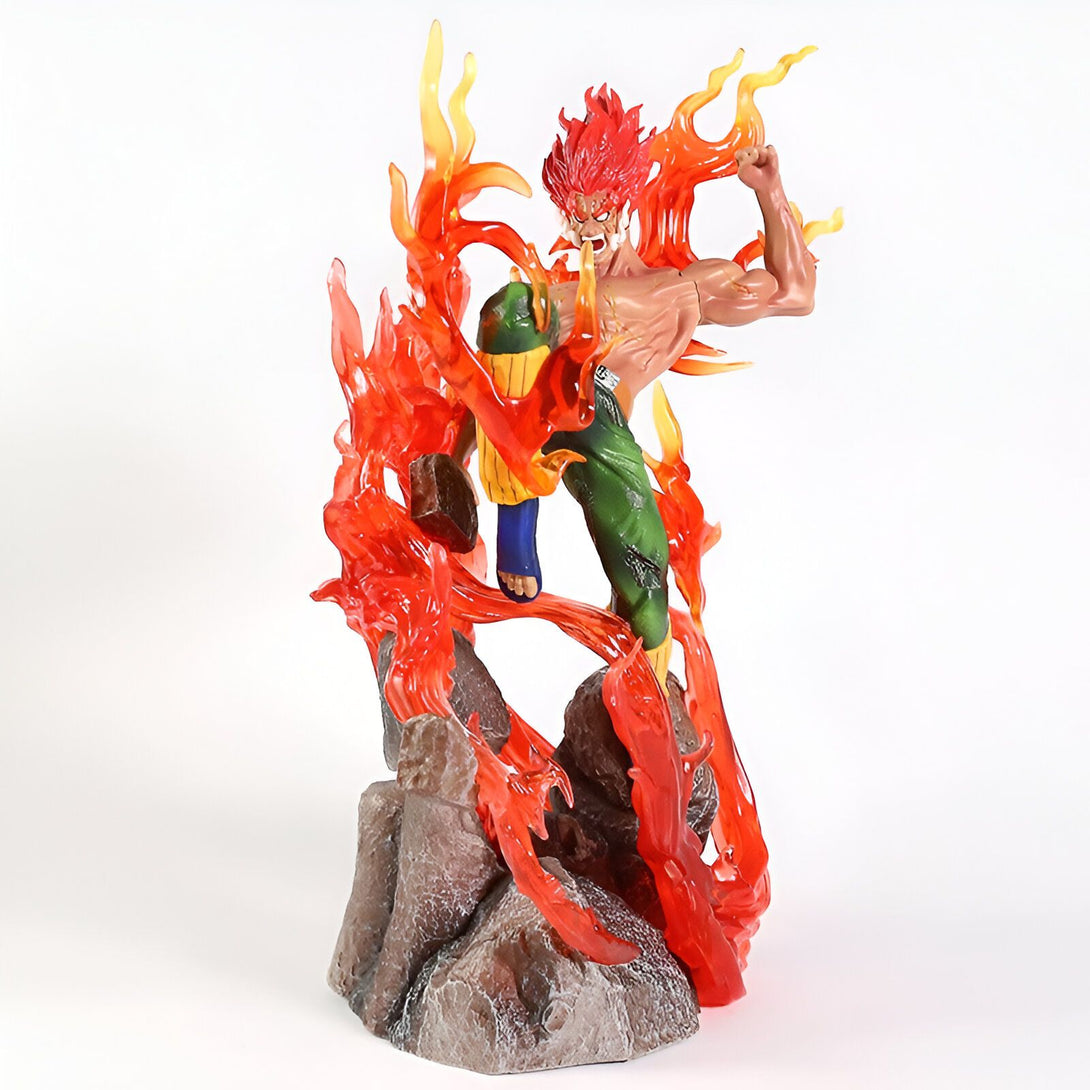 Statue de Naruto en PVC représentant Might Guy en mode Huit Portes Intérieures, entouré de flammes rouges et orange, sur une base rocheuse.