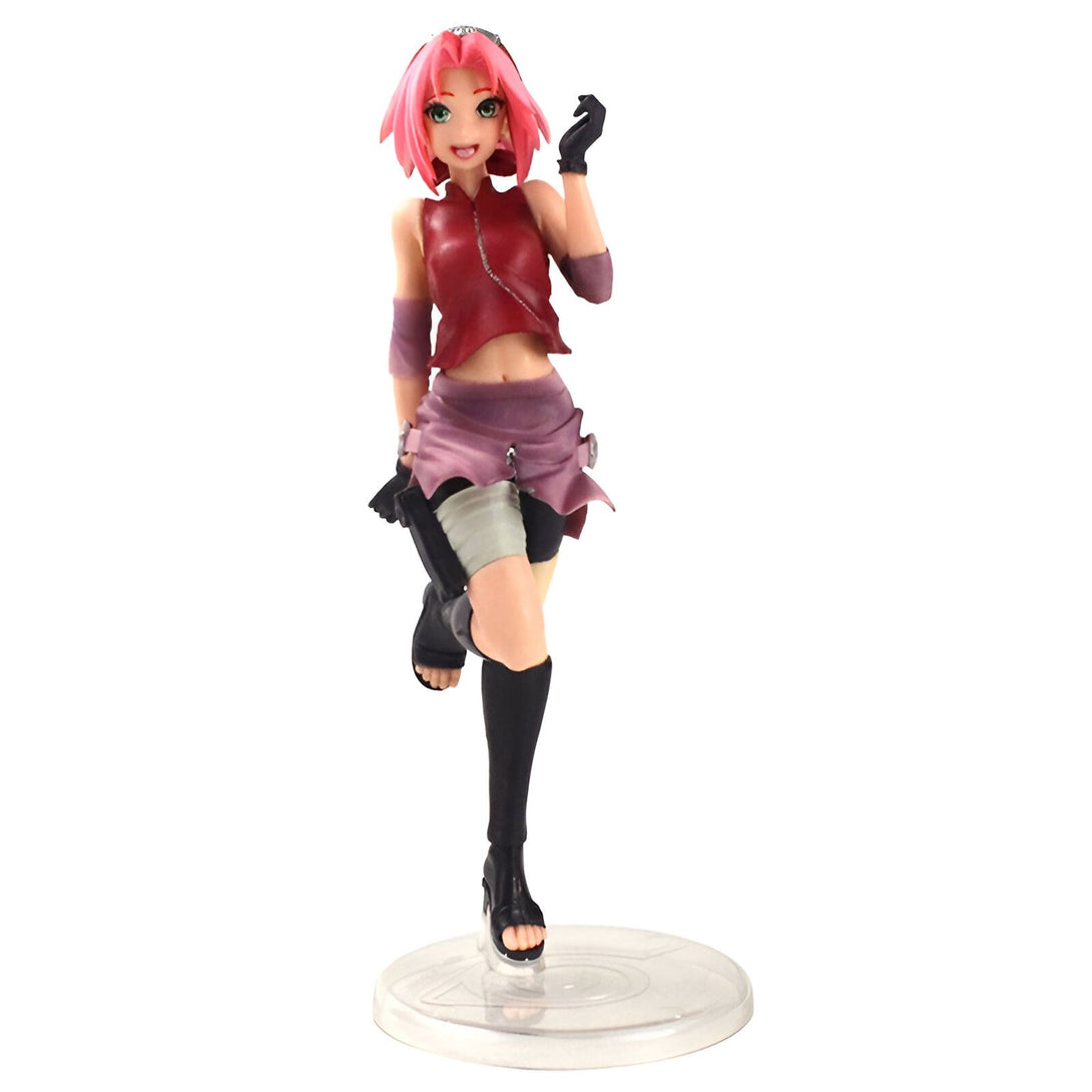 Figure de Sakura Haruno, personnage de l'anime Naruto, en position dynamique avec une tenue rouge et rose. Elle est représentée avec ses cheveux roses et ses yeux bleus.