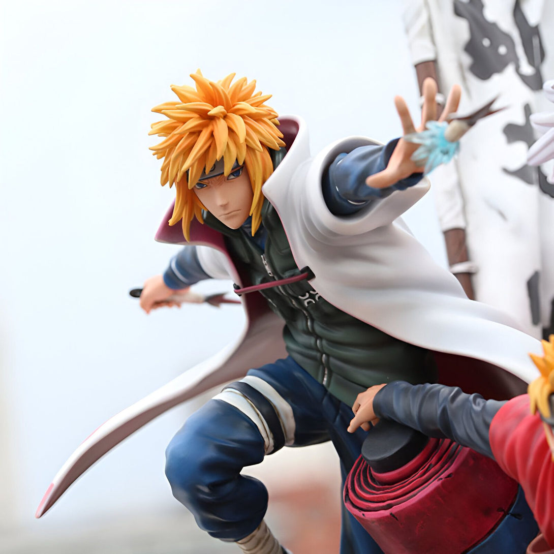 Figurine de Naruto Shippuden représentant Minato Namikaze, le Quatrième Hokage, en action. Il est représenté dans sa tenue de Hokage, avec ses cheveux blonds et son katana. Il est prêt à attaquer, les yeux déterminés.
