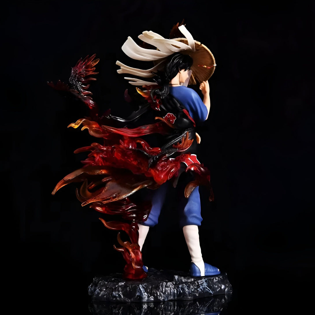 Figure de Naruto Uzumaki en mode "Kurama" avec un manteau rouge vif et des flammes orange, portant une tenue bleue et un chapeau de paille.