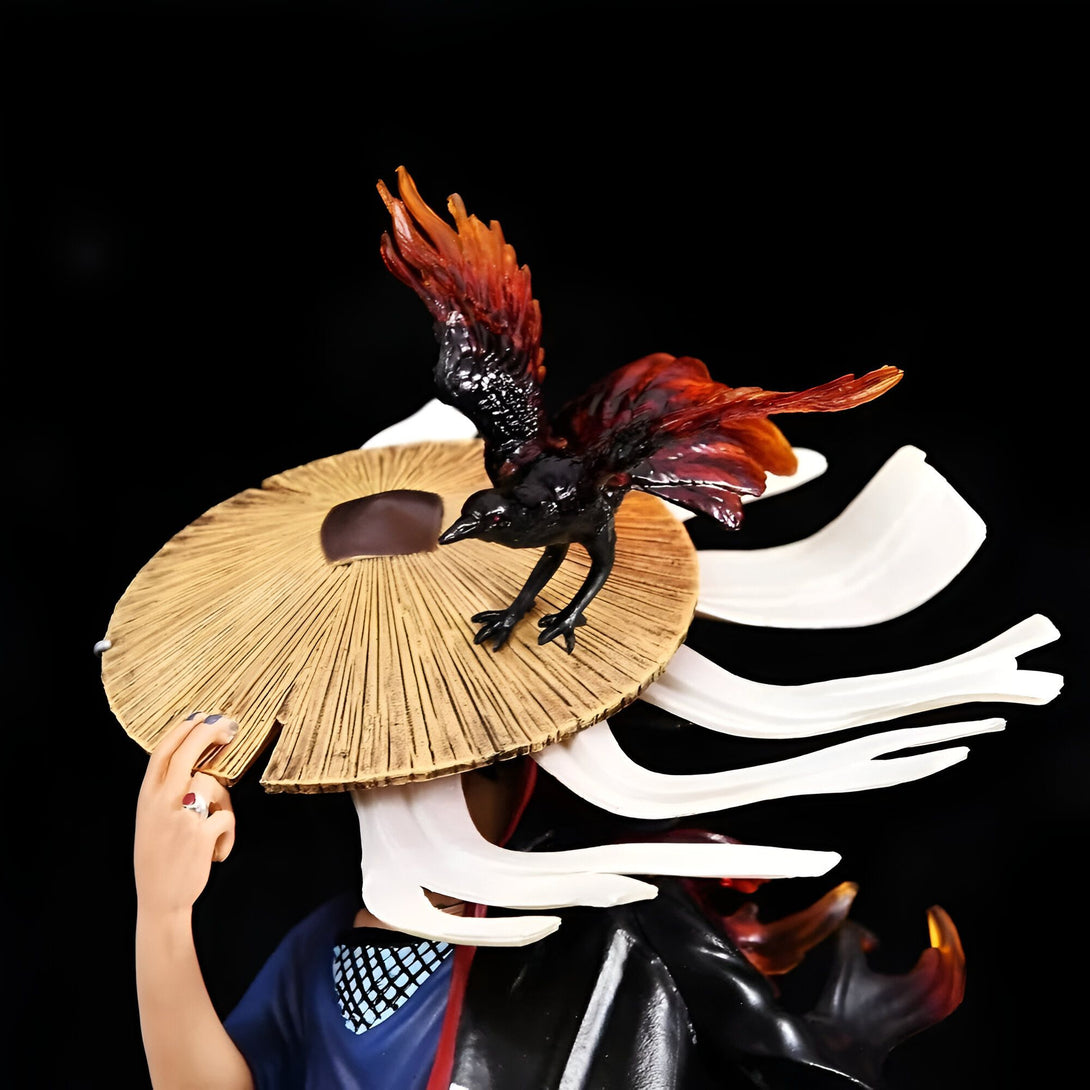 Statue de Naruto Uzumaki avec son chapeau de paille et son corbeau noir aux plumes orange, un excellent cadeau pour les fans de Naruto.