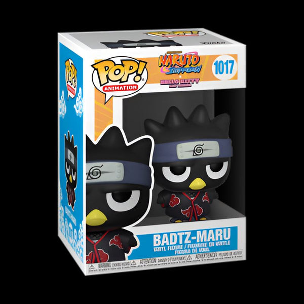 Figure Funko Pop de Badtz-Maru en tenue de ninja Naruto. La figurine représente le personnage d'Hello Kitty habillé avec une tenue de ninja rouge avec le symbole de la feuille sur le front. La figurine est présentée dans une boîte d'emballage.
