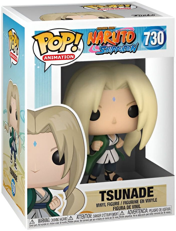 Une figurine Funko Pop de Tsunade du manga Naruto Shippuden. La figurine représente Tsunade dans sa tenue de ninja, avec ses cheveux blonds et ses yeux bleus. Elle est en position de combat, avec son bras droit levé et son poing serré. La figurine est dans sa boîte d'origine.