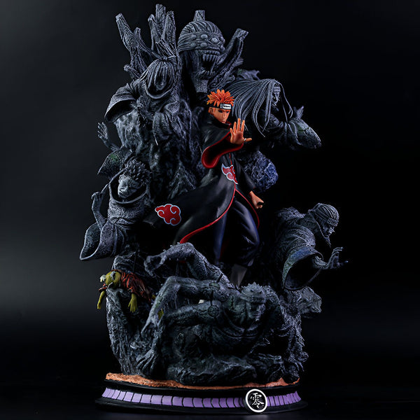 Statue de Pain du manga Naruto, debout sur un piédestal rocheux entouré de ses six corps. La figurine représente le personnage principal dans sa tenue emblématique.