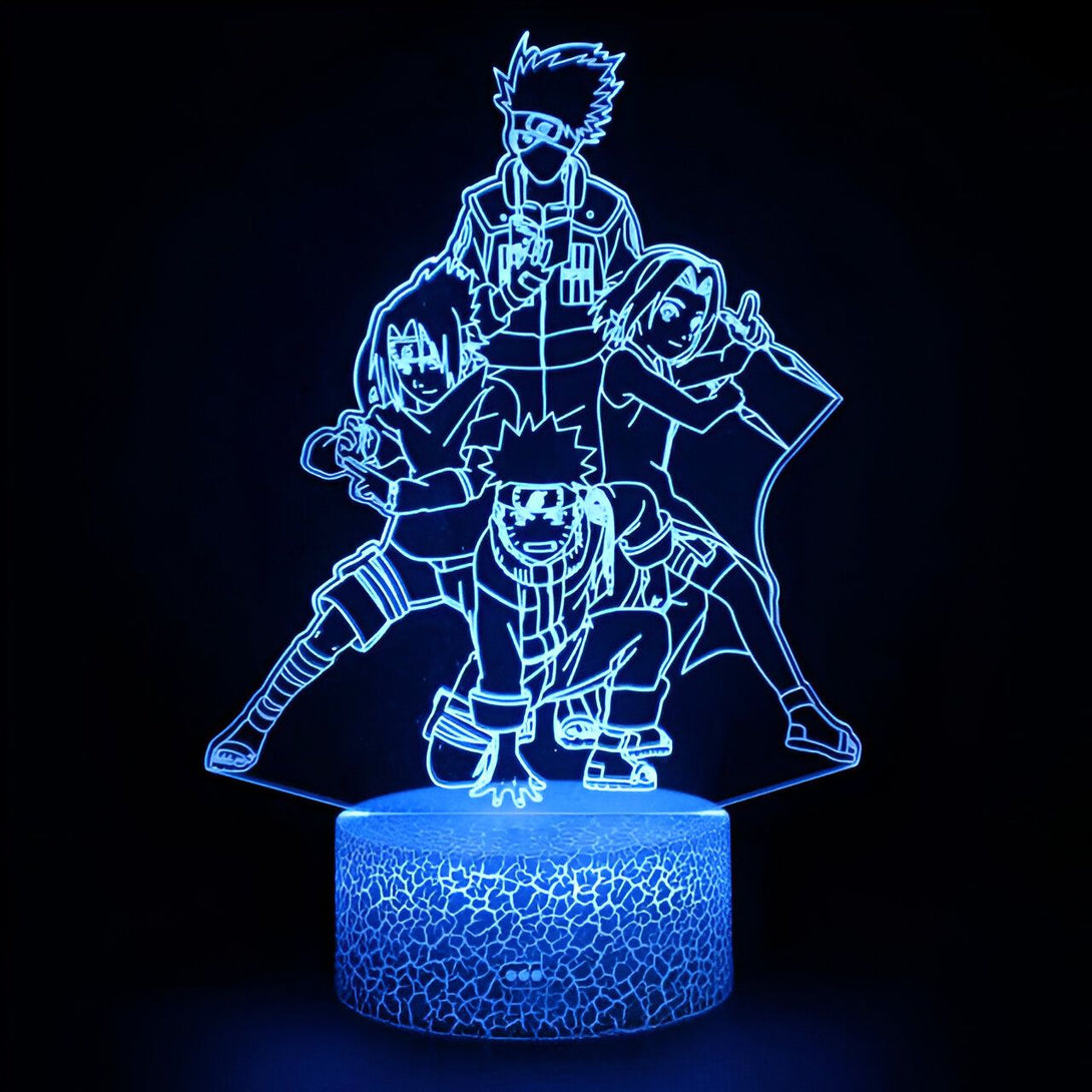 Lampe 3D représentant les personnages de l'anime Naruto : Naruto, Sasuke, Kakashi, Sakura et Shikamaru. La lampe est bleue et diffuse une lumière douce.  Parfaite pour les fans de Naruto.