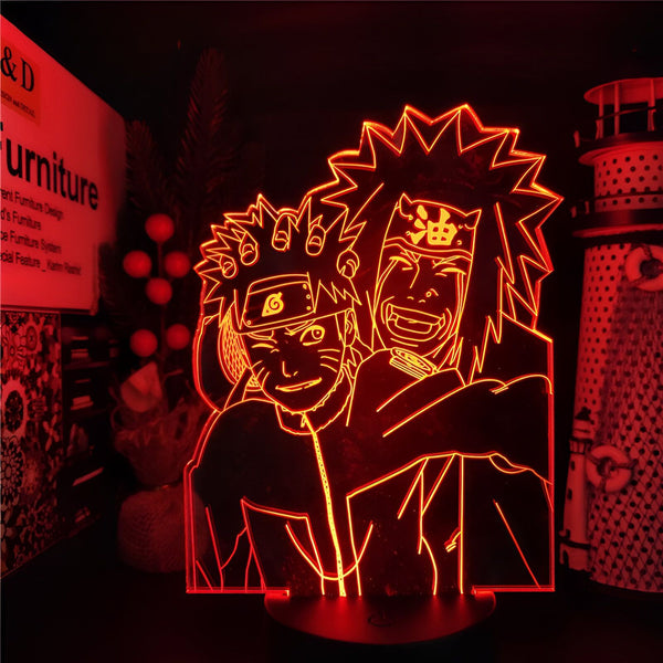 Lampe de chevet à LED avec une image de Naruto et Jiraya du manga Naruto. La lampe est allumée et projette une lumière rouge sur le mur.
