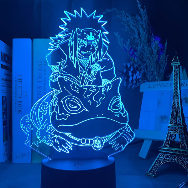 Lampe LED Naruto représentant Jiraiya monté sur Gamakichi. La lumière bleue éclaire la figurine de manière à ce que les détails soient visibles.