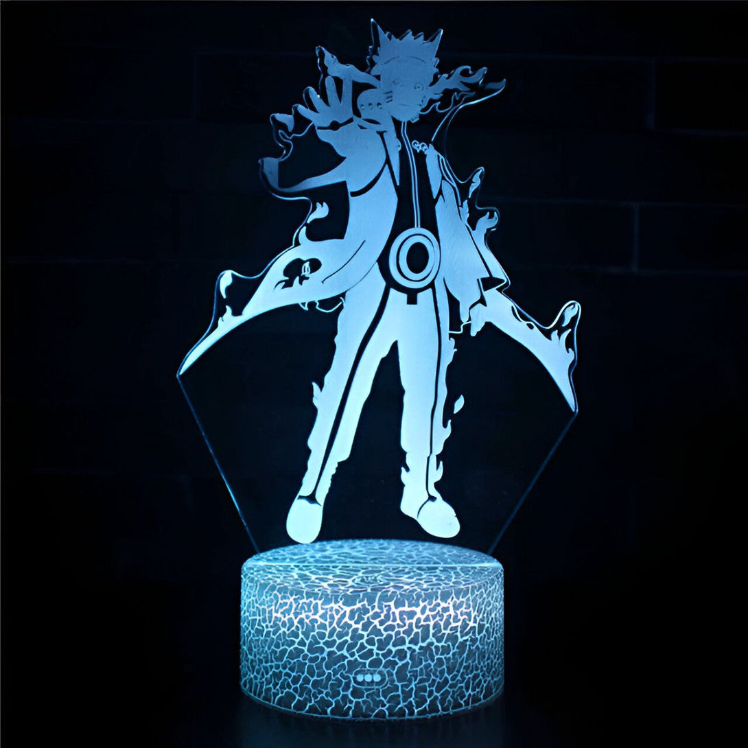 Lampe à LED en forme de Naruto Uzumaki, le personnage principal de l'anime Naruto. La lampe est en acrylique et représente Naruto dans une pose dynamique, avec ses bras levés et sa cape flottant derrière lui. La base de la lampe est en bois et est décorée de motifs inspirés de l'univers de Naruto.