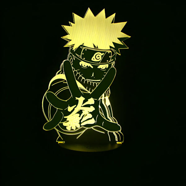 Lampe 3D de Naruto Uzumaki, le protagoniste de l'anime et manga Naruto, faisant un signe de paix avec son emblématique bandeau frontal. La lumière éclaire ses cheveux blonds, son visage et son costume orange. Cette lampe est un cadeau idéal pour les fans de Naruto.