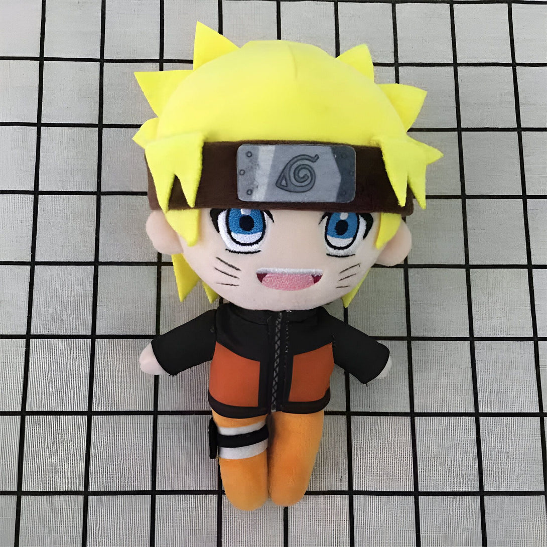 Peluche Naruto Uzumaki, un personnage populaire de l'anime Naruto, avec ses cheveux blonds, son bandeau frontal et sa tenue orange. Cette peluche est parfaite pour les fans de l'anime.
