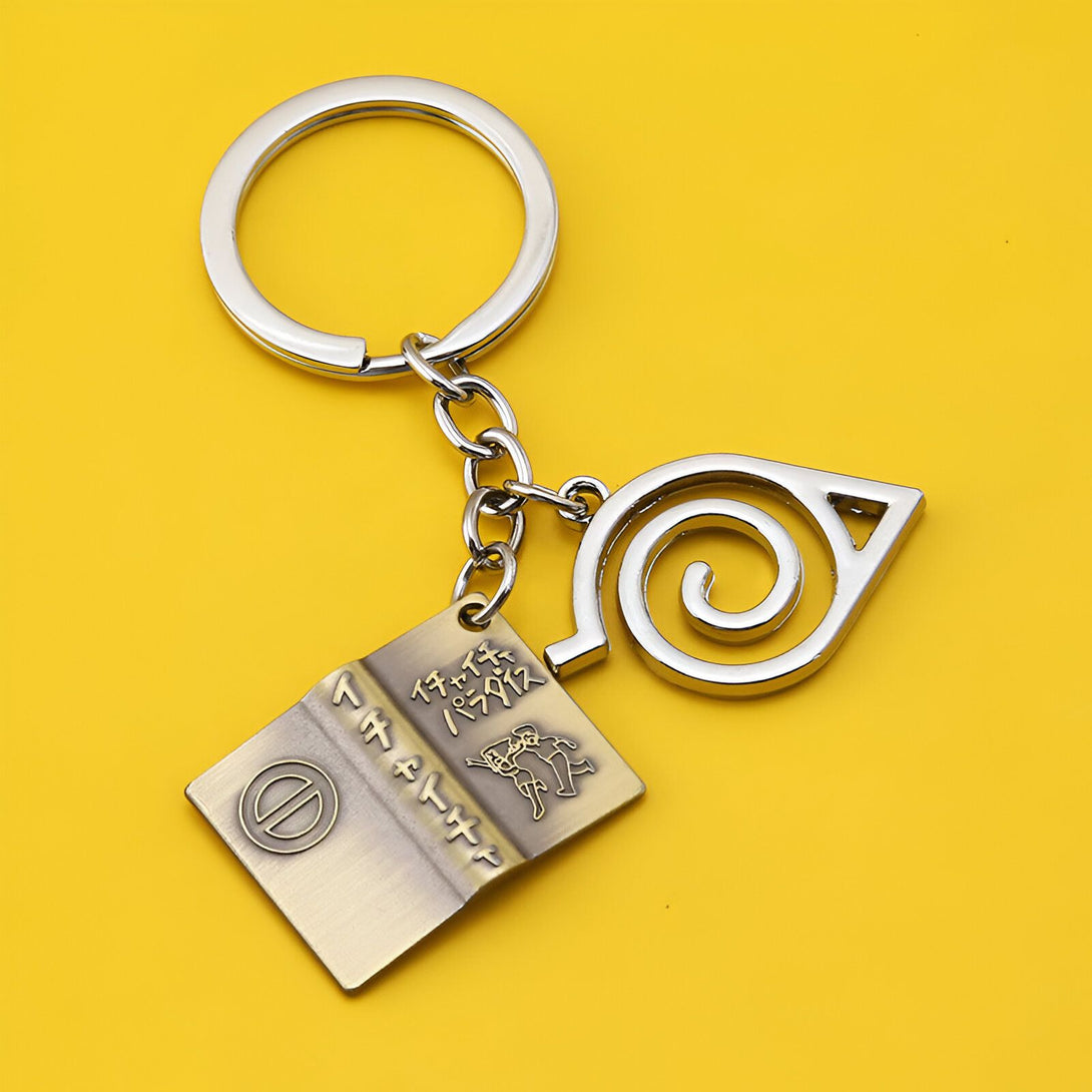 Porte-clés Naruto avec un symbole de feuille de feuille de feuille d'Hokage et le logo de Naruto.  Parfait pour les fans de l'anime !